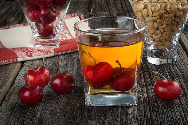 Whiskey Cocktail With Cherries and Peanuts