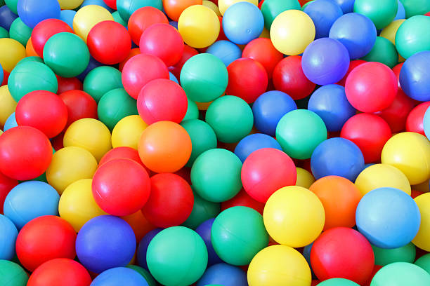 istock bright plastic ball in a swimming pool 453742603
