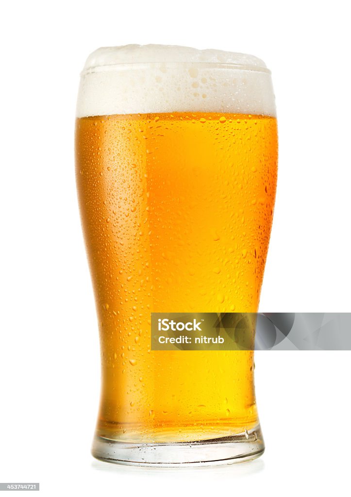 Glass of cold beer with condensation glass of beer isolated on white background Beer - Alcohol Stock Photo