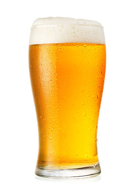 Glass of cold beer with condensation stock photo