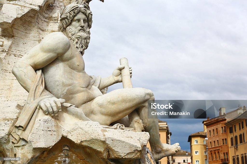 That's Rome, statue in Piazza Navona Statue from Fountain of four rivers in Piazza Navona, Roma. Art Stock Photo