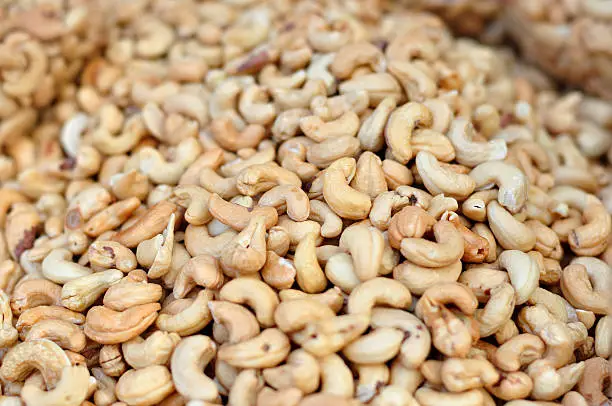 Group of cashew-nuts selling at market fair.