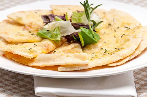 istock garlic pita bread pizza with salad on top 453756013