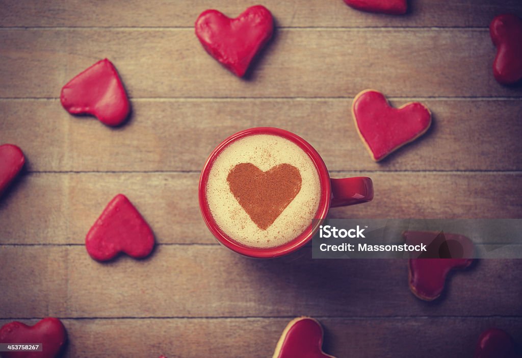 Cup of coffee with heart symbol and candy around. Art Stock Photo