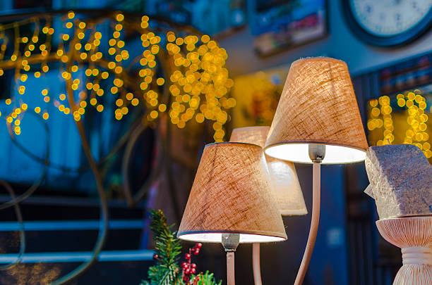 istock modern vibrant table lamp and christmas lights at background 453760507