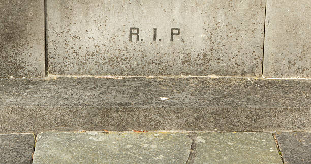 istock The letters RIP on an old grave 453766175