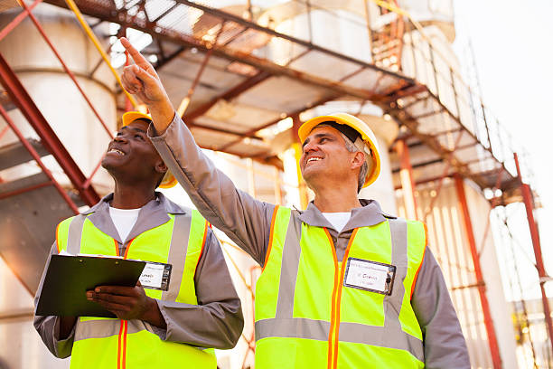 istock petrochemical co-workers working in the plant 453772825