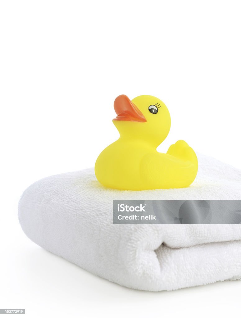 Bath accessories: towels and Yellow rubber duckies Bathroom Stock Photo