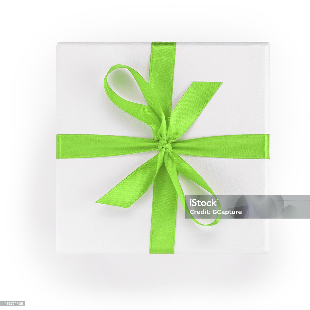 white textured gift box with green ribbon percent symbol white textured gift box with green ribbon percent symbol, from above Birthday Present Stock Photo