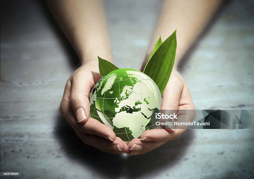 environment conservation concept - Europe planet in your hands - Europe Sustainable Resources Stock Photo