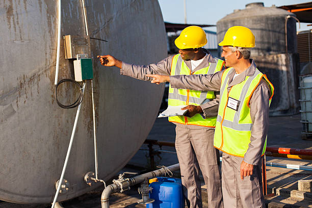 istock industrial engineers inspecting fuel tank 453778393