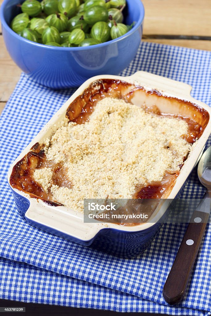 Gooseberry crumble Gooseberry crumble in a baking tin Baked Stock Photo