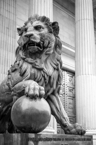 Sculpture of a Lion in front of a government building in Madrid