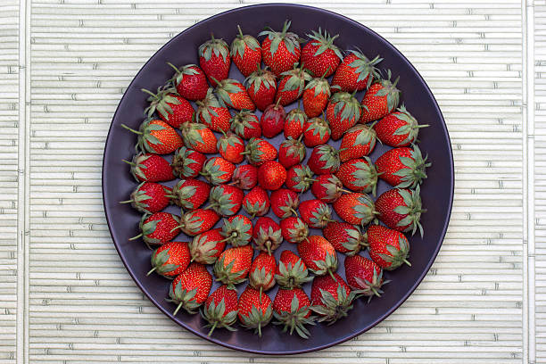 Ripe strawberry on a plate