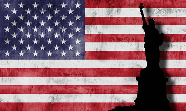 istock Statue of liberty and american flag. 453788299