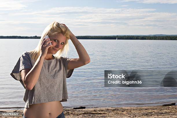 Young Woman Talking On Smart Phone Stock Photo - Download Image Now - Crop Top, Women, One Woman Only