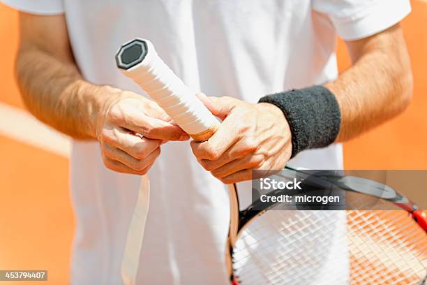 Putting New Grip Tape On Tennis Racket Stock Photo - Download Image Now - Tennis, Gripping, Adhesive Tape