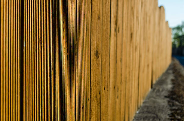 istock yellow fence background 453797215