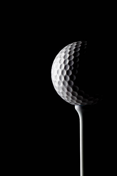 istock Golf ball against black background 453805317
