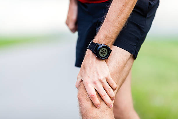 istock Man with knee pain from running injury 453805719