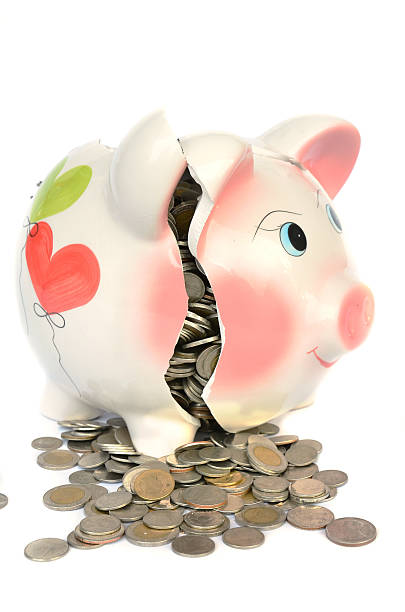 istock Pink piggy bank broken with money 453807749