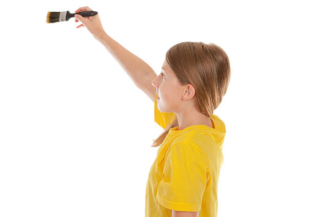 istock Young Girl Holding Paintbrush 453821211
