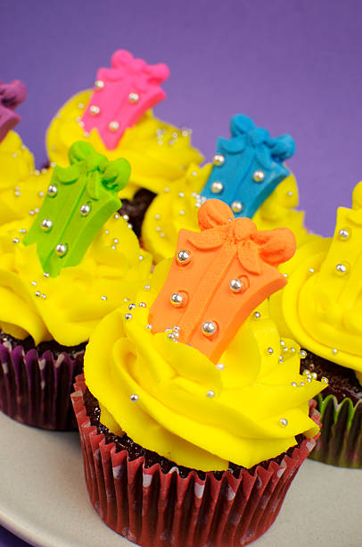 istock Bright and festive cupcakes with yellow icing frosting 453835245