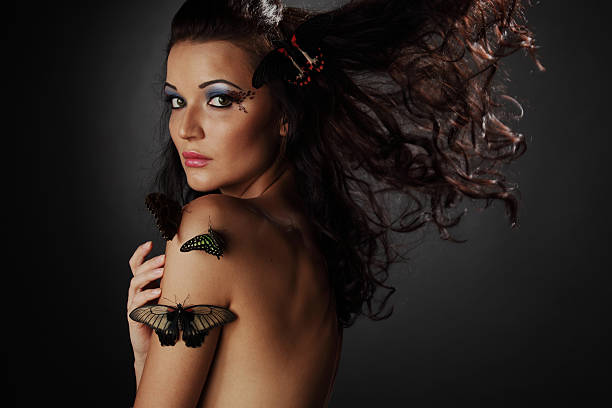 istock woman and butterfly 453836775