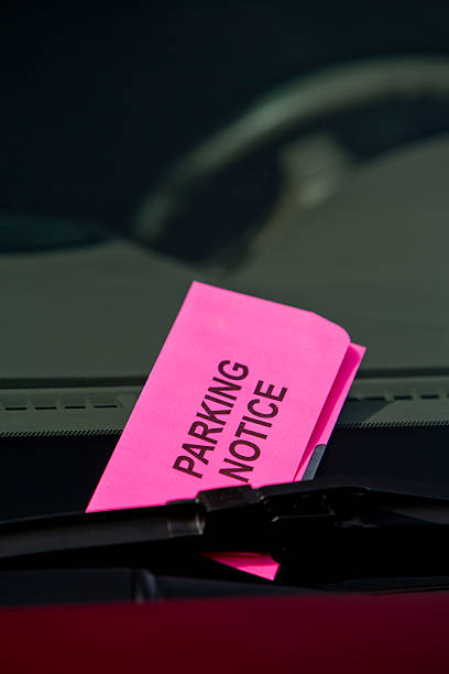 istock Parking Ticket Notice on Car Windshield Close Up Verticle 453839857