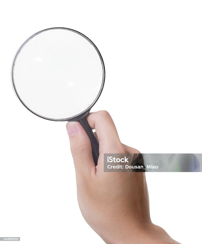 Holding a Magnifying Glass Isolated on White Background Asian male holding a magnifying glass. Isolated on white background Black Color Stock Photo