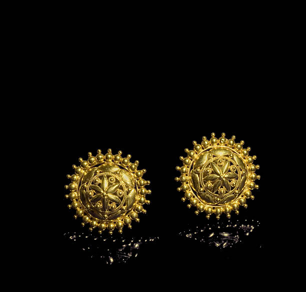 gold earrings stock photo