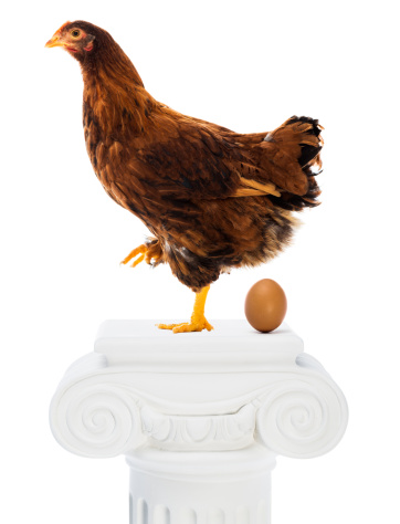 Hen with egg on column