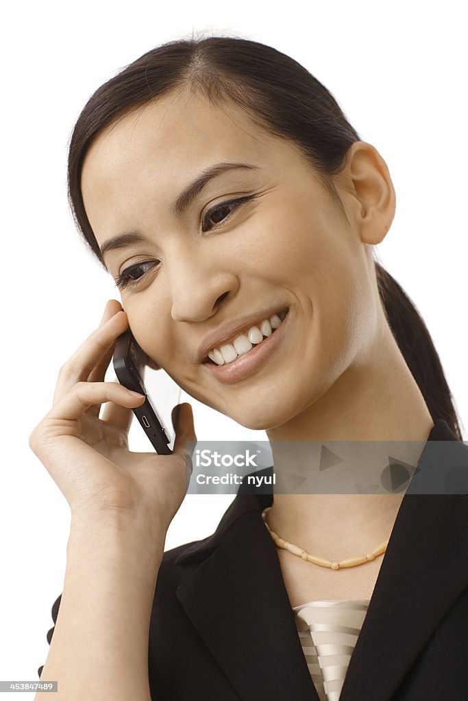 Happy woman on phone call Happy young woman talking on mobilephone, smiling. Close-up.. 20-24 Years Stock Photo