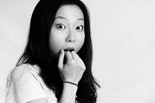 istock Young woman covering her mouth 453852803
