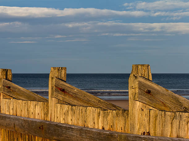 istock Lossiemouth beach breakwater 453857523