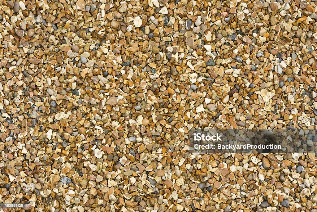 Tileable gravel pebbles as background Pebble small stone gravel background that is tileable and has repeating pattern to make much larger textured background Abstract Stock Photo