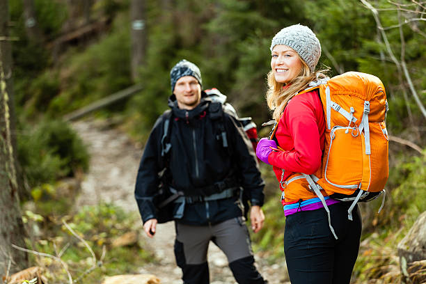 istock Couple happy hikers walking in forest 453868907