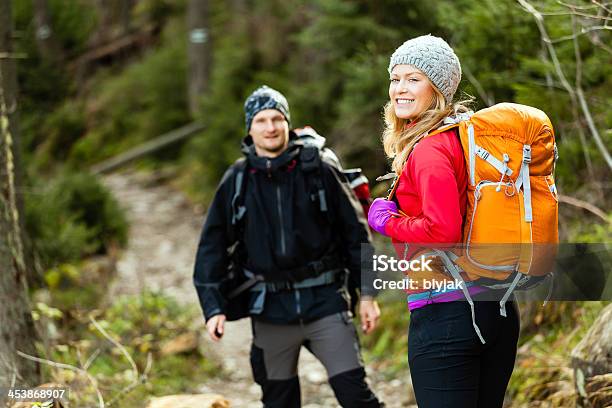 Couple Happy Hikers Walking In Forest Stock Photo - Download Image Now - Achievement, Active Lifestyle, Activity