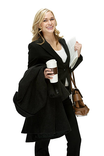 istock Blonde woman holding cup and newspaper 453869567