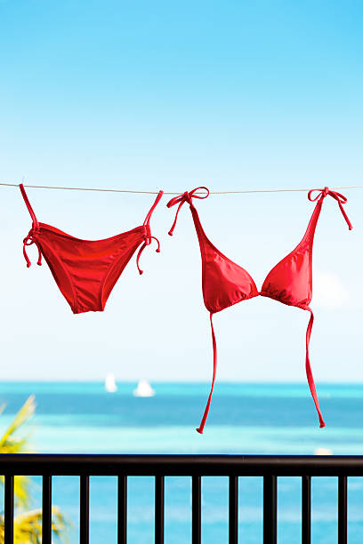 istock Red Bikini Hanging on Clothes Line by Caribbean Sea Balcony 453869599