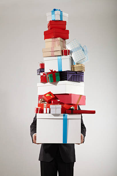 ビジネスマン用のスタックのギフトボックス - christmas stack gift carrying ストックフォトと画像