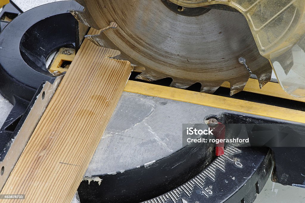 Circular Saw Close Up Industrial circular saw cutting a plank of wood in close up Art And Craft Stock Photo