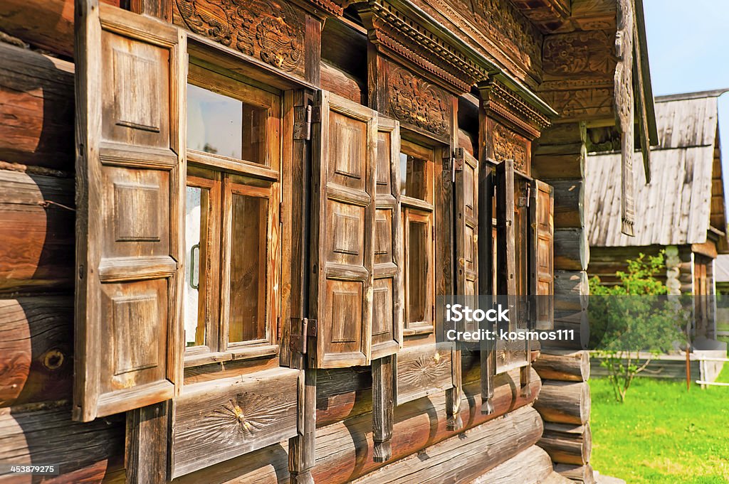 Windows with wooden architraves and shutters Ancient Stock Photo