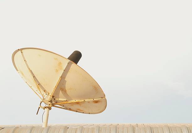 Satellite dish A roofmounted home-style satellite dish. parabol stock pictures, royalty-free photos & images