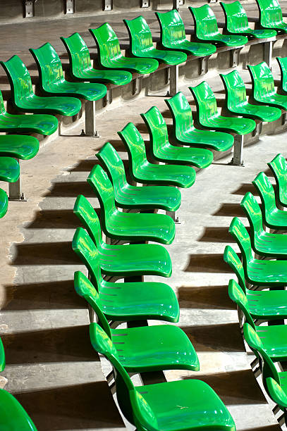 istock Plenty of green plastic seats at stadium . 453880901