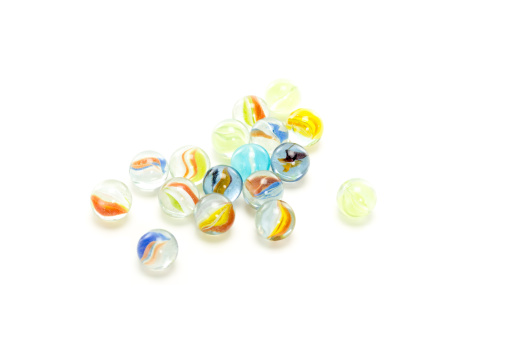 Some colourful marbles on white background