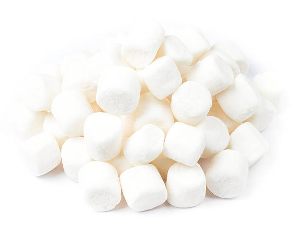 istock pile of mini white puffy marshmallows on  background. 453891543