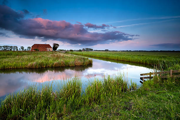 istock little farmhouse at sunset 453892453