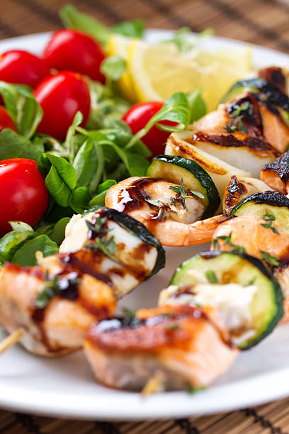 istock Fish skewers with salad 453893069