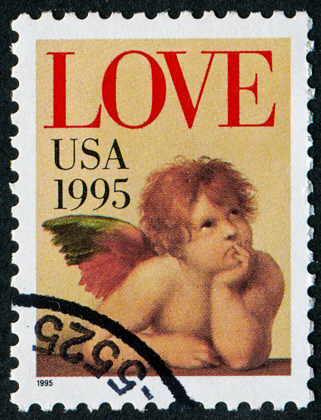 Love Stamp Cancelled Stamp From The United States Featuring An Angel And The Word Love. The Angel Is From The Original Artwork Of Raphael Who Lived From 1483 Until 1520. sistine madonna stock pictures, royalty-free photos & images